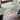 white glass standing desk
